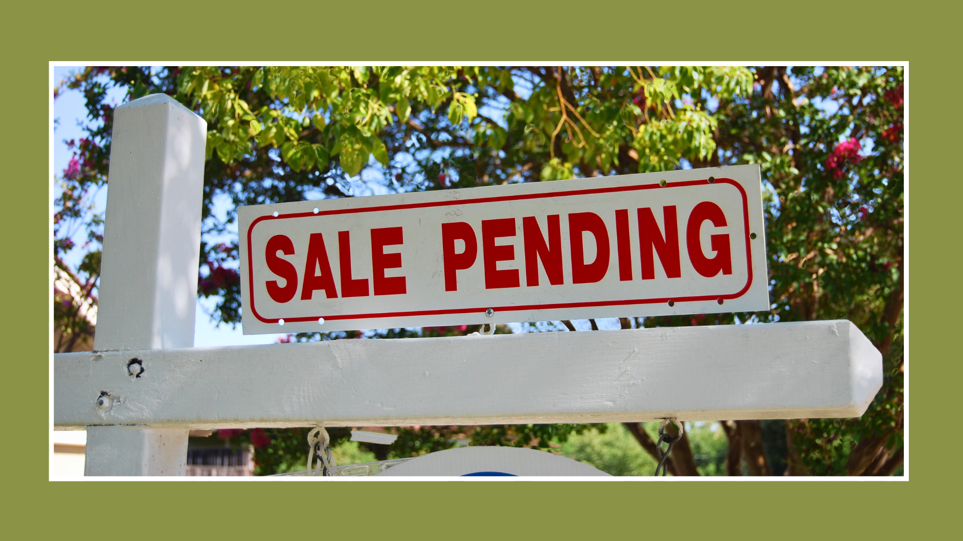 Sale Pending sign on a white real estate post, signaling a home is under contract but may still accept backup offers.